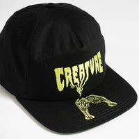 ROLLING IN THE GRAVE SNAPBACK HAT